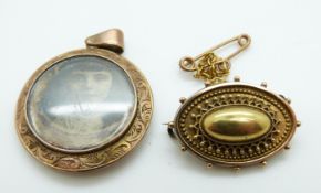 A Victorian brooch with filigree and sphere decoration with a glass compartment to the back and a
