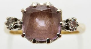 An 18ct gold ring set with a cushion cut pink sapphire and two diamonds, size M, 4.