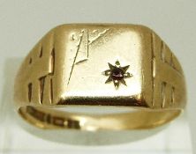 A 9ct gold signet ring set with a garnet, size W, 2.6g, M, 1.
