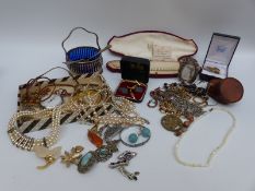 A collection of costume jewellery including mother of pearl necklace, silver brooches,