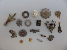 A collection of silver and white metal brooches including filigree, Victorian sweetheart brooch,