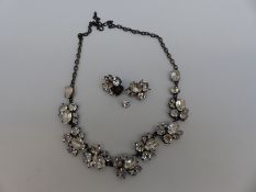 A Butler & Wilson necklace and earrings in original box