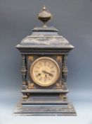 American 8-day Victorian mantel clock in ebonised wooden case with columned decoration to side