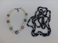 A Butler & Wilson necklace made up of faux pearls and crystal set spheres and a Butler & Wilson