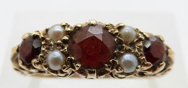 A 9ct gold ring set with garnets and pearls, size P, 3.