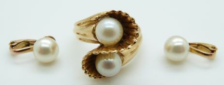 A yellow metal ring set with two pearls and a pair of 9ct gold Ciro earrings set with a faux pearls,