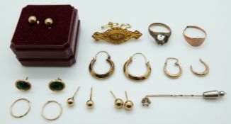 A 9ct gold brooch set with a diamond with compartment to back,