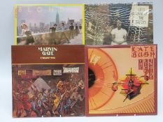 A box of mixed rock, pope and soul albums.