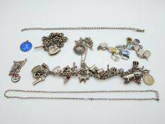 A silver and enamel St Christopher, silver charm bracelet set with enamel shields,