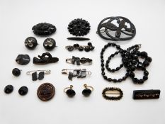 A collection of jet jewellery including French jet brooch and buttons,