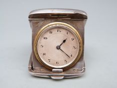 George V hallmarked silver travelling clock in fold out case,