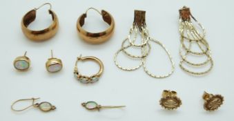Two pairs of 9ct gold earrings set with opals,