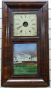 American ogee-cased 19thC wall clock with painted Roman dial and second door below decorated with