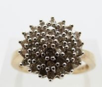A 9ct gold ring set with diamonds in a cluster, size P, 4.