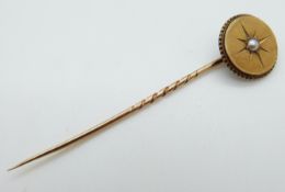 A Victorian stick pin set with a pearl to the centre, 4.