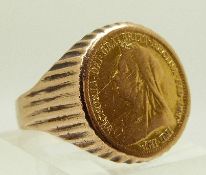 A 9ct gold ring set with a gold half sovereign, size W/X, 10.