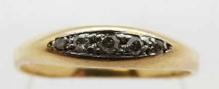 A yellow metal ring set with five diamonds, size O, 2.