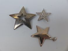 A silver and paste star brooch, silver chains, silver and agate sword brooch, silver sun brooch,