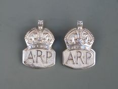 Two hallmarked silver ARP badges,