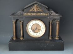 A Marti 19thC French slate mantel clock with Romanesque classical case,