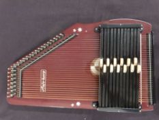 Musima autoharp, German made, in lacquered finish with 32 strings and 12 chords,