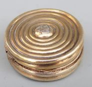 A Swedish gilt white metal circular vinagrette with concentric circular pattern and pierced inner