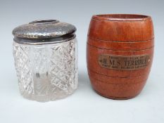 A hallmarked silver topped dressing table pot and HMS Terrible barrel