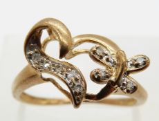 A 9ct gold ring set with diamonds in the form of a heart and a butterfly, size L, 1.