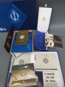 A collection of silver and cupro nickel coins including £5 presentation packs,