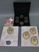 1936 Year of the Three Kings cased collection comprising four oval medallion gold plated coins