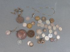 A small collection of silver coins,