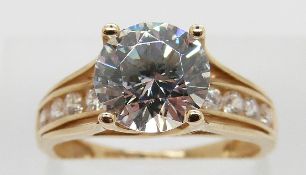 A 14ct gold ring set with cubic zirconia, size M, 3.