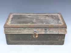 A 19thC camphor wood and brass studded leather trunk with drop handles,