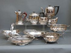A collection of silver plated ware including a four piece tea set, baskets etc,