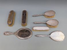 Two three piece hallmarked silver dressing table sets, one Mappin & Webb,