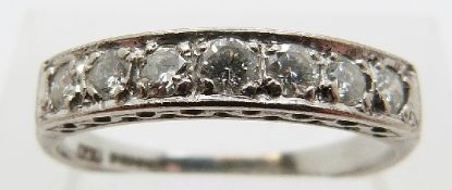 An 18ct white gold half eternity ring set with seven diamonds, each approximately 0.06ct, size O, 2.