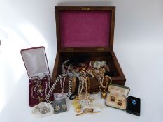 A collection of costume jewellery including tigers eye necklace, tiger's eye cufflinks,