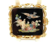 A Victorian gold brooch set with a micro mosaic plaque depicting two birds amongst a bouquet