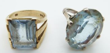 A 9ct gold ring set with an emerald cut aquamarine and a silver ring set with blue paste, size O, 7.