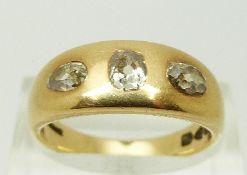 An 18ct gold ring set with an old cut diamond of approximately 0.