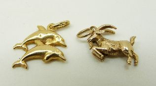 A 9ct gold pendant in the form of dolphins and a 9ct gold pendant in the form of a goat, 3.