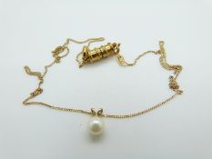 A 9ct gold chain and 9ct gold pendant set with a pearl