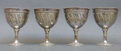 A set of four silver plated egg cups