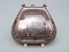 A Russian white metal Niello purse depicting a building, width 7cm,