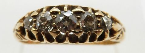 An 18ct gold ring set with five diamonds in a pierced setting, size N, 3.