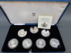 A Royal Mint cased set of seven silver coins to commemorate HRH The Queen Mother's 80th Birthday