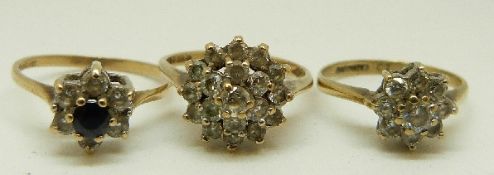 Two 9ct gold rings set with cubic zirconia and a 9ct gold ring set with a sapphire surrounded by