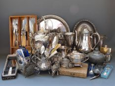 A quantity of silver plate to include spirit kettle on wood branch effect stand, cutlery,
