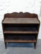 A three tier bookcase with shaped gallery W80 x D38 x H90cm