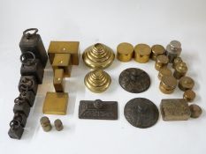 A quantity of various weights including coin weights, cast iron weights, Avery test weights,